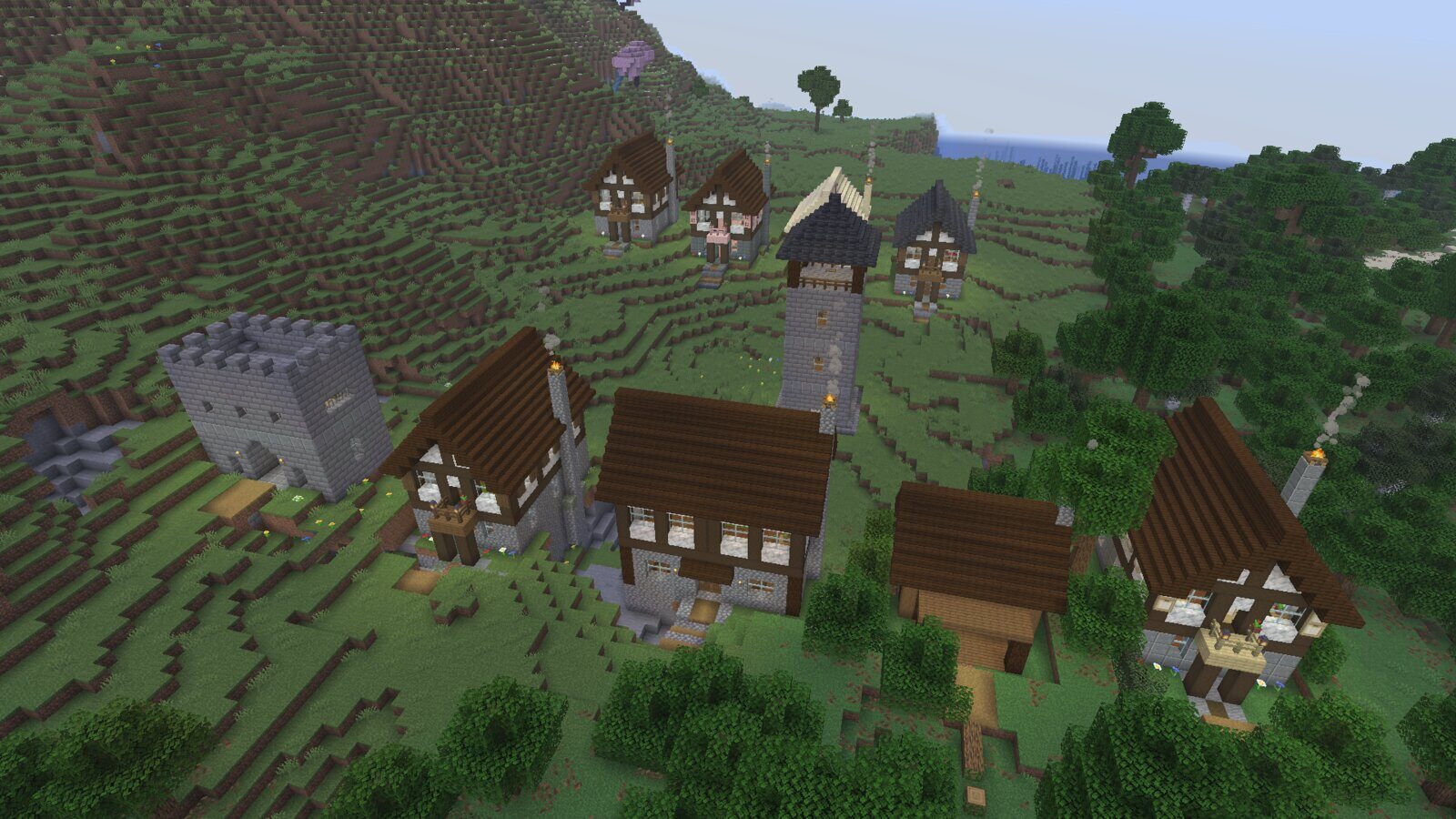 A small Minecraft village on a hillside, built with Architect